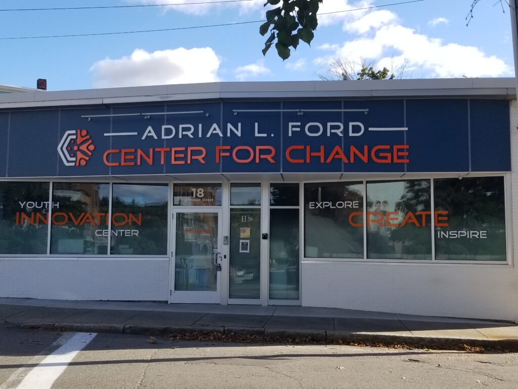 Front view of Adrian L. Ford Center for Change building with motivational words on windows.